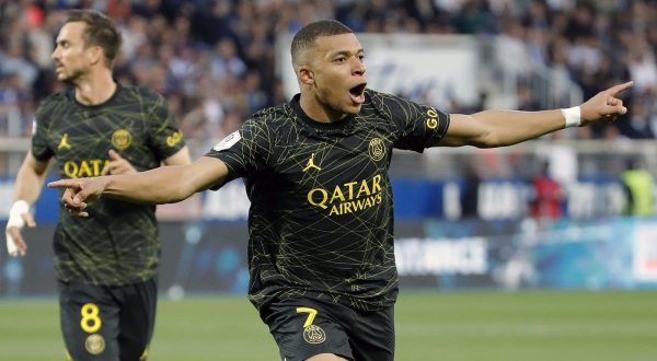 epa10644619 Paris Saint Germain's Kylian Mbappe celebrates after scoring during the French Ligue 1 soccer match between AJ Auxerre and Paris Saint-Germain in Auxerre, France, 21 May 2023.  EPA/TERESA SUAREZ