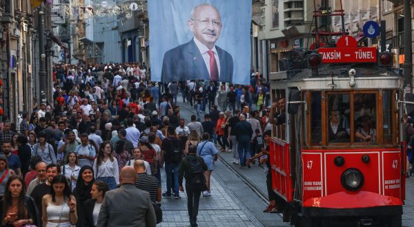 epaselect epa10655861 The nostalgic tram passes under an election campaign poster of Turkish presidential candidate Kemal Kilicdaroglu, leader of the opposition Republican People's Party (CHP), at Istiklal Street in Istanbul, Turkey, 26 May 2023. General elections had been held in Turkey on 14 May, where none of the candidates exceeded the 50 percent mark in the first round. The second round of presidential elections between Turkish President Recep Tayyip Erdogan and his challenger Kemal Kilicdaroglu, the leader of the opposition Republican People's Party (CHP), will be held on 28 May.  EPA/SEDAT SUNA