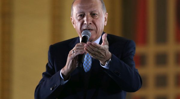 epa10661321 Turkish President Recep Tayyip Erdogan addresses supporters after winning re-election in Turkey's run-off vote, at the Presidential Palace in Ankara, Turkey, 28 May 2023. Erdogan won Turkey's presidential run-off and has been re-elected President, according to Turkey's Supreme Election Council.  EPA/NECATI SAVAS