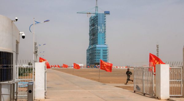 epa10661519 A member of People's Liberation Army (PLA) runs on the site of Shenzhou-16 manned space flight mission on the eve of launching in Jiuquan, Gansu province, China, 29 May 2023. The Shenzhou-16 manned space flight mission is expected to be launched on 30 May, and will transport three Chinese astronauts to the Tiangong space station.  EPA/ALEX PLAVEVSKI