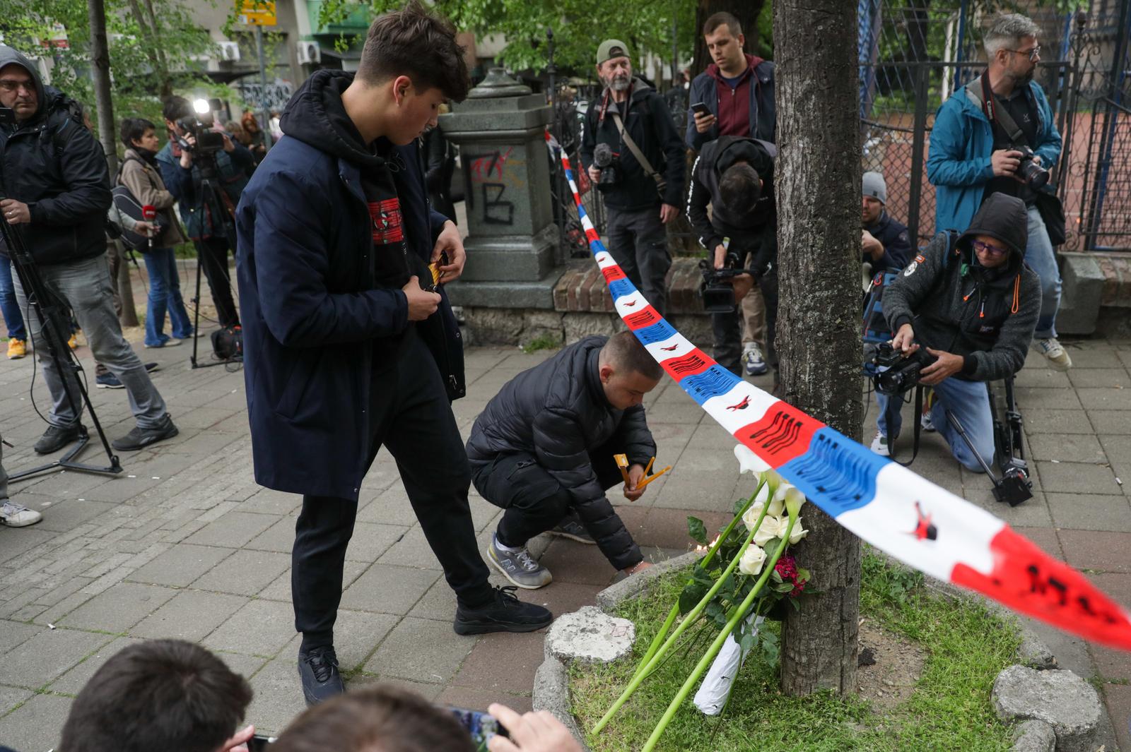 03, May, 2023, Belgrade - Citizens lay flowers and light candles in front of the "Vladislav Ribnikar" Elementary School, where a tragedy occurred this morning when a seventh-grade student killed eight students and a security guard. Photo: M.M./ATAImages

03, maj, 2023, Beograd - Gradjani polazu cvece i pale svece ispred Osnovne skole "Vladislav Ribnikar” gde se jutros desila tragedija kada je ucenik sedmog razreda ubio osam ucenika i radnika obezbedjena. Photo: M.M./ATAImages Photo: M.M./ATAImages/PIXSELL