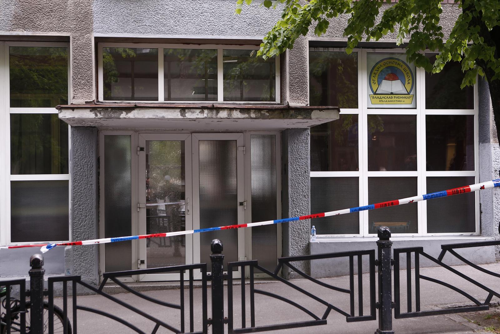 03, May, 2023, Belgrade - The entrance to the "Vladislav Ribnikar" Elementary School, where a tragedy occurred this morning when a seventh-grade student killed eight students and a worker, was secured. Photo: Amir Hamzagic/ATAImages

03, maj, 2023, Beograd - Ulaz u Osnovnu skolu "Vladislav Ribnikar” gde se jutros desila tragedija kada je ucenik sedmog razreda ubio osam ucenika i radnika obezbedjena. Photo: Amir Hamzagic/ATAImages Photo: Amir Hamzagic/ATAImages/PIXSELL