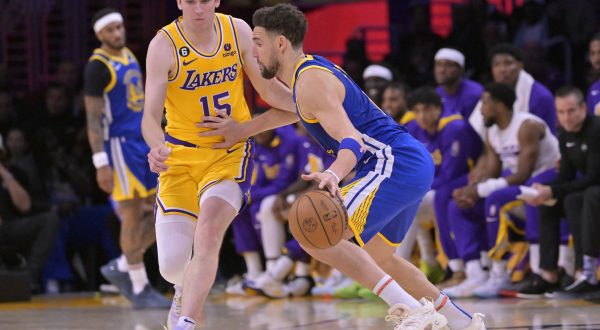 May 12, 2023; Los Angeles, California, USA;  Los Angeles Lakers guard Austin Reaves (15) guards Golden State Warriors guard Klay Thompson (11) in the second half of game six of the 2023 NBA playoffs at Crypto.com Arena. Mandatory Credit: Jayne Kamin-Oncea-USA TODAY Sports Photo: Jayne Kamin-Oncea/REUTERS