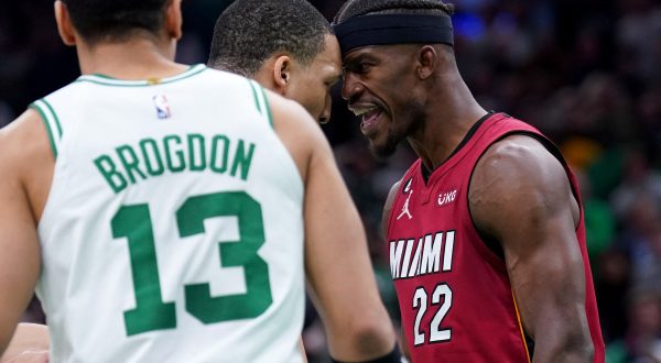 May 19, 2023; Boston, Massachusetts, USA; Boston Celtics forward Grant Williams (12) and Miami Heat forward Jimmy Butler (22) react after a play during the second half of game two of the Eastern Conference Finals for the 2023 NBA playoffs at TD Garden. Mandatory Credit: David Butler II-USA TODAY Sports Photo: David Butler II/REUTERS