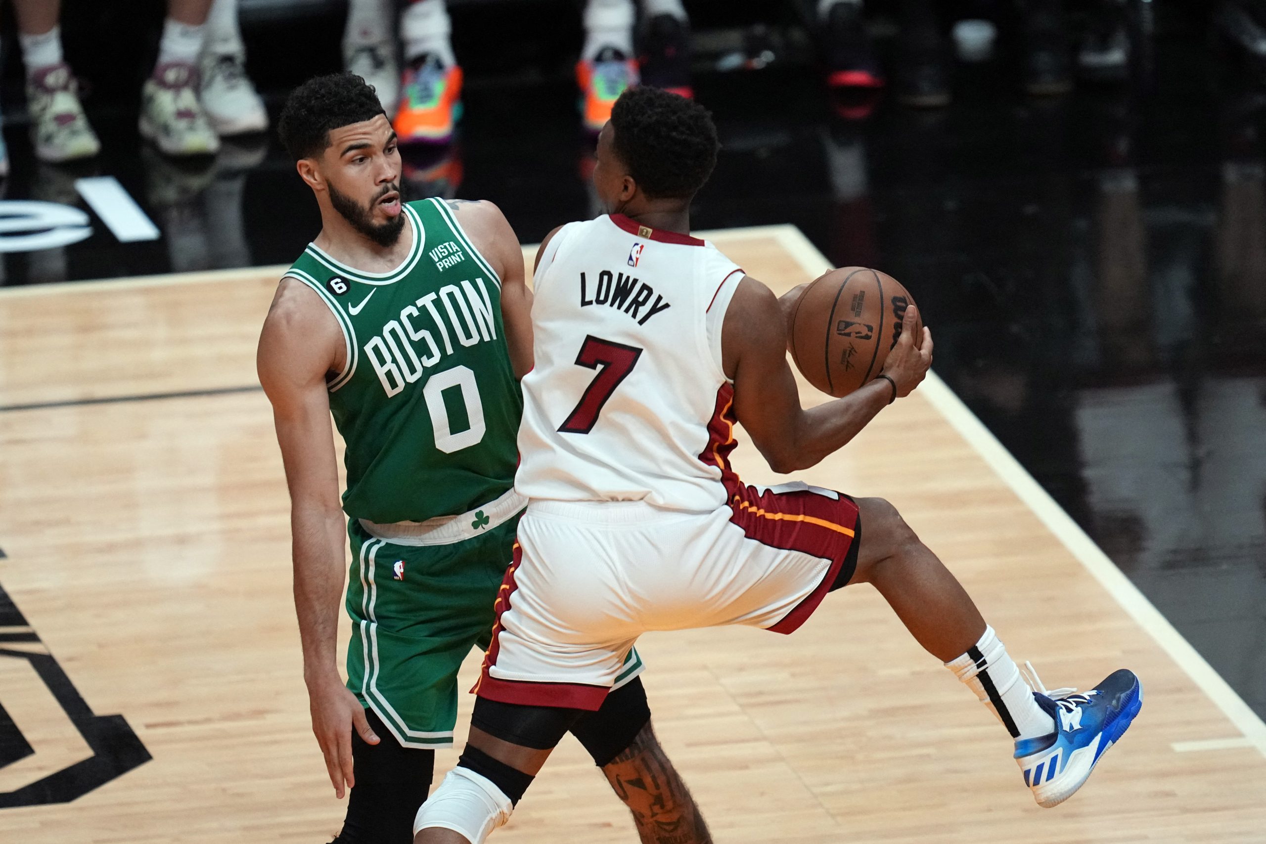 May 23, 2023; Miami, Florida, USA; Miami Heat guard Kyle Lowry (7) controls the ball against Boston Celtics forward Jayson Tatum (0) in the fourth quarter during game four of the Eastern Conference Finals for the 2023 NBA playoffs at Kaseya Center. Mandatory Credit: Jim Rassol-USA TODAY Sports Photo: Jim Rassol/REUTERS