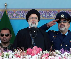 epa10578013 Iranian President Ebrahim Raisi watches to the sky as jest fighters fly during a ceremony marking the annual National Army Day in Tehran, Iran, 18 April 2023. Raisi during his speech warned western countries on Iran's military action uppon 'any minor mistake' from their side, and also specifically threatened Israel.  EPA/ABEDIN TAHERKENAREH