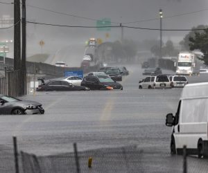 epa10571669 Several cars are stuck in flood water on Fort Lauderdale International Airport's West Perimeter road in Fort Lauderdale, Florida, USA, 13 April 2023. Heavy rains in the past days produced flooding in the lower areas of the Miami-Dade and Broward counties.  EPA/CRISTOBAL HERRERA-ULASHKEVICH