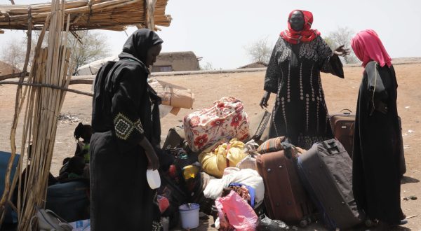 epa10622979 People who fled the conflict in Sudan wait for transport to move toward the town of Renk, at Wunthaou near the border with Sudan, South Sudan, 12 May 2023. Fleeing the armed conflict between the Sudanese military and the RSF (Rapid Support Forces) militia which started last 15 April, some 40,000 people have arrived into South Sudan, according to the UNHCR. Most of the refugees are part of the some 800,000 South Sudanese who had fled the war in South Sudan in the first place and they are returning to a country which is barely out of conflict itself with tensions still remaining in many areas and more than two million internally displaced people. The scarcity of food and water and the military escalation had made the stay of most civilians impossible in Sudan. Upon arriving at Joda border crossing, the refugees head to a transit area set up by the UNHCR in the small town of Renk, where various UN agencies assist them with registration, food, health check and logistics to leave Renk which is not equipped to house a large refugee population.  EPA/AMEL PAIN