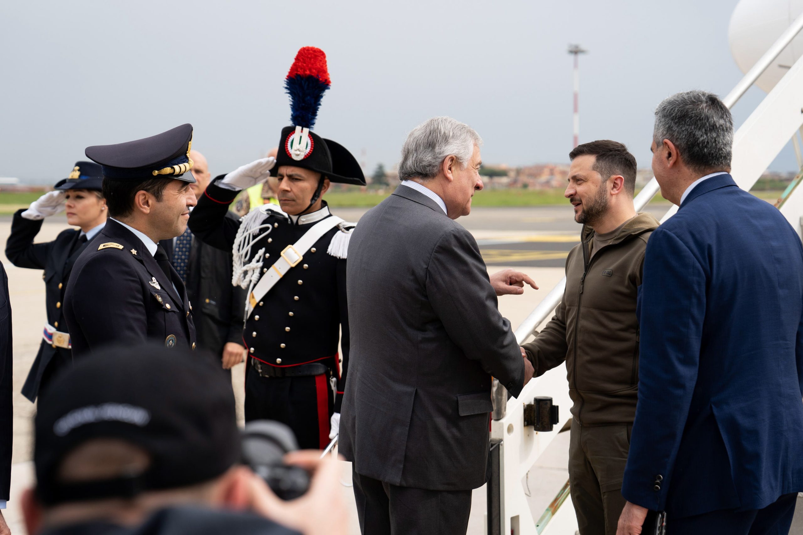 epa10624439 Italian Foreign Minister Antonio Tajani (C) welcomes Ukrainian President Volodymyr Zelensky (2-R) as he arrives at Ciampino Airport in Rome, Italy, 13 May 2023. It is the first time for Zelensky to come to Italy since the start of the Russian invasion of Ukraine in February 2022. He is scheduled to meet with the Italian President and Pope Francis.  EPA/TELENEWS