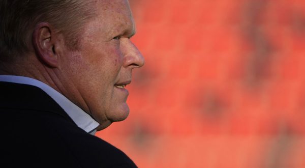 Barcelona's head coach Ronald Koeman checks the field ahead of the Spanish La Liga soccer match between Rayo Vallecano and FC Barcelona at the Vallecas stadium in Madrid, Spain, Wednesday, Oct. 27, 2021. (AP Photo/Manu Fernandez)