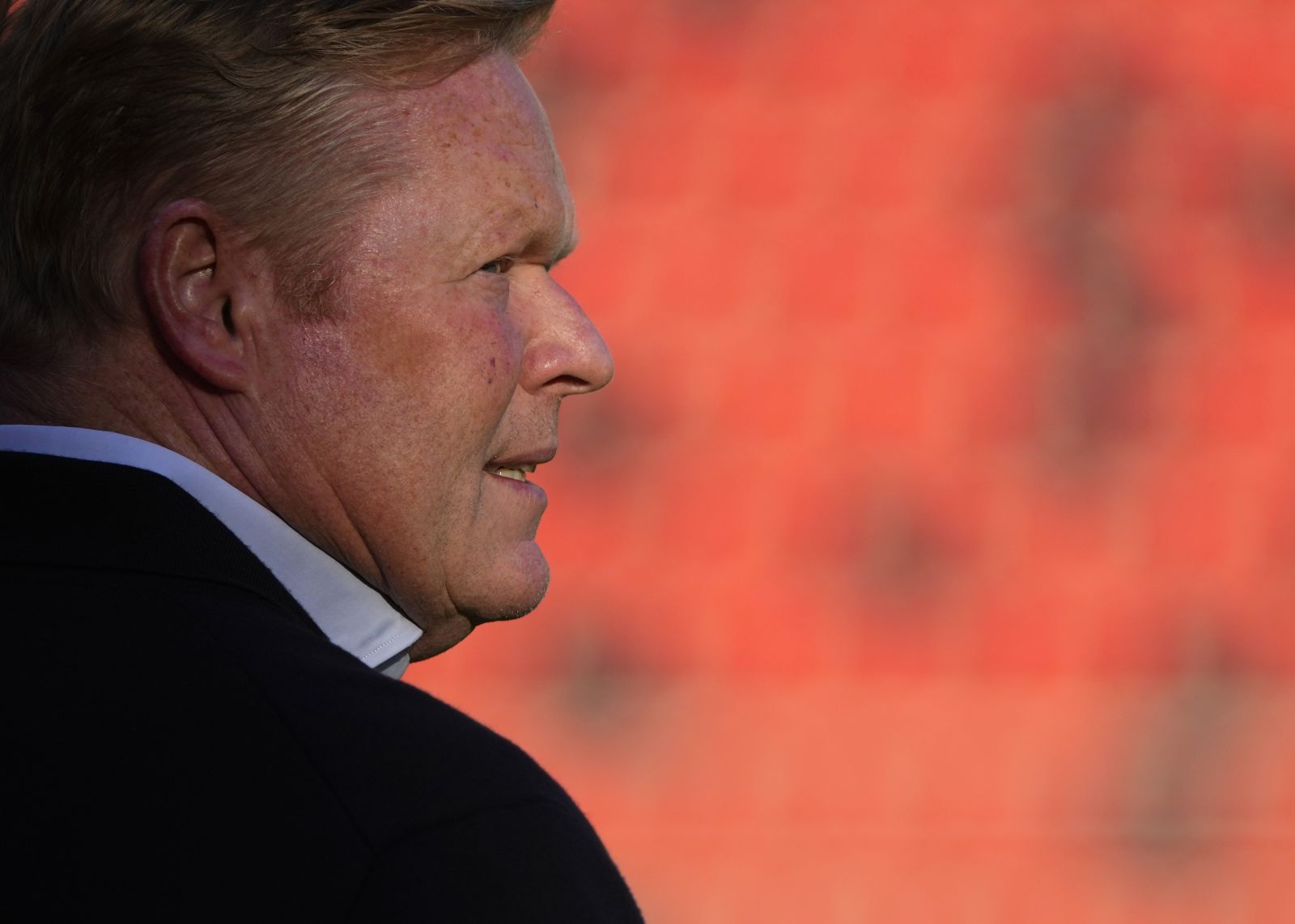 Barcelona's head coach Ronald Koeman checks the field ahead of the Spanish La Liga soccer match between Rayo Vallecano and FC Barcelona at the Vallecas stadium in Madrid, Spain, Wednesday, Oct. 27, 2021. (AP Photo/Manu Fernandez)