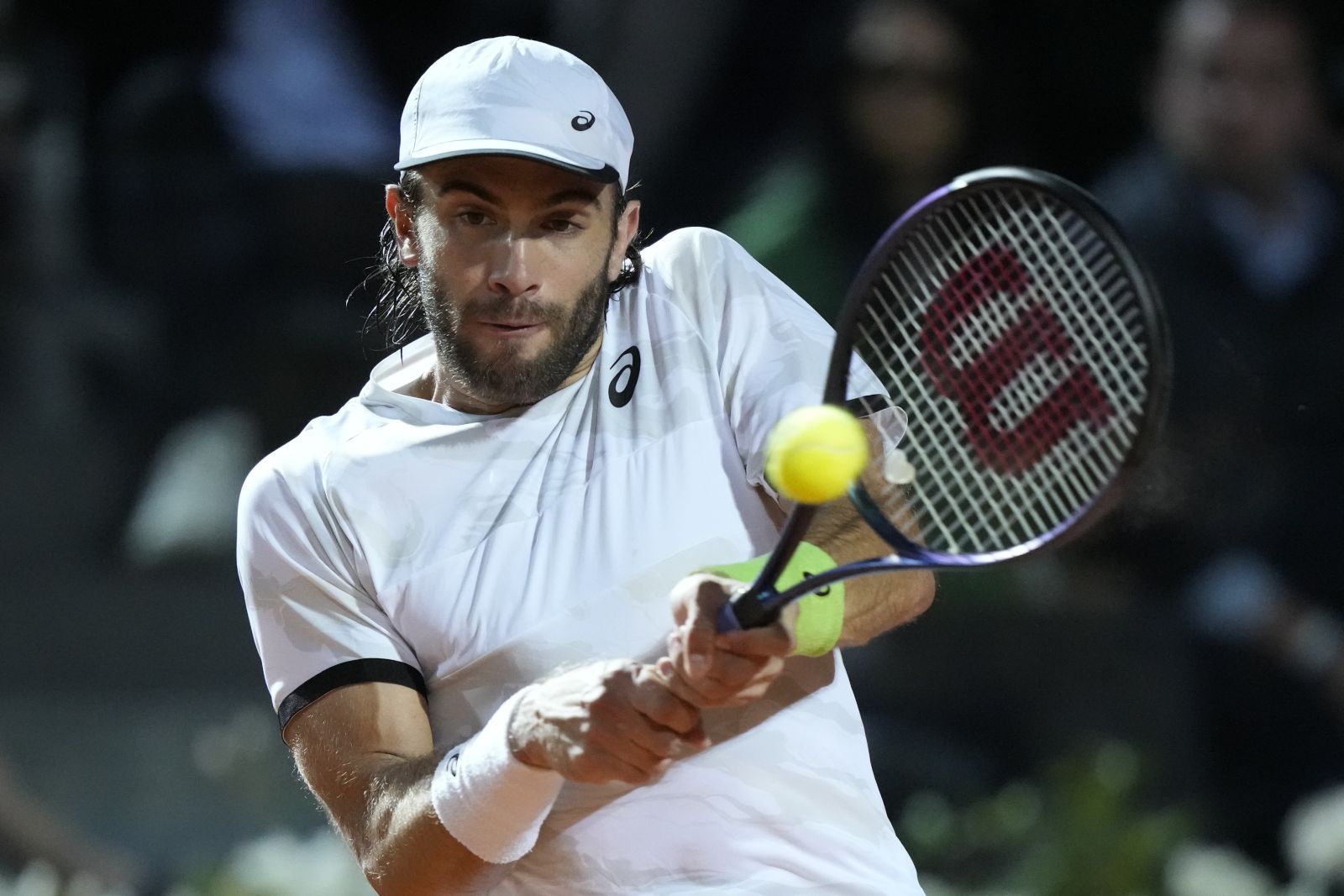 Borna Coric of Croatia returns the ball to Stefanos Tsitsipas of Greece, during a quarterfinal match at the Italian Open tennis tournament, in Rome, Thursday, May 18, 2023. (AP Photo/Andrew Medichini)