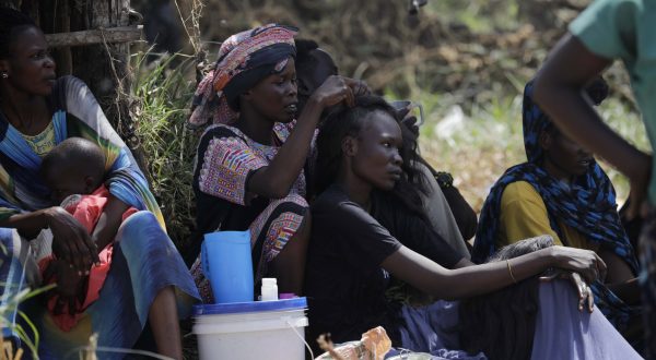 epa10628536 South Sudanese returnees who fled the ongoing conflict in Sudan, gather in the vicinity of the fluvial port of Renk as they wait to be transported south, in the Upper Nile State town of Renk, South Sudan, 14 May 2023. According to Mohajer Mhadi Khalifa, head of the boats union in charge of regulating the transport on the Nile in Renk, five boats are planned to transport the returnees to their areas of origin on the Nile towards the Southern Town of Malakal and other locations. On 14 May 2023 a group of 348 people embarked for the trip, following 577 others who made the same trip the previous day after days of waiting in the fluvial port of Renk. The transport was coordinated and organized by the IOM, Caritas and the RCC (the South Sudanese Relief and Rehabilitation Commission). According to the United Nations, some 200,000 people have fled the conflict in Sudan between 15 April and 12 May 2023. Most of them left towards neighboring countries such as Egypt, Tchad, South Sudan or Ethiopia, and about two million people were internally displaced. Leaving behind them the armed conflict between the Sudanese military and the RSF (Rapid Support Forces) militia, most of the refugees in South Sudan are South Sudanese returnees, part of the some 800,000 who had previously fled the war in South Sudan and who are now returning to a country which is barely out of conflict itself with tensions still remaining in many areas.  EPA/AMEL PAIN