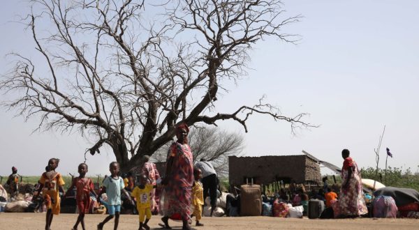 epa10628534 South Sudanese returnees who fled the ongoing conflict in Sudan, gather in the vicinity of the fluvial port of Renk as they wait to be transported south, in the Upper Nile State town of Renk, South Sudan, 14 May 2023. According to Mohajer Mhadi Khalifa, head of the boats union in charge of regulating the transport on the Nile in Renk, five boats are planned to transport the returnees to their areas of origin on the Nile towards the Southern Town of Malakal and other locations. On 14 May 2023 a group of 348 people embarked for the trip, following 577 others who made the same trip the previous day after days of waiting in the fluvial port of Renk. The transport was coordinated and organized by the IOM, Caritas and the RCC (the South Sudanese Relief and Rehabilitation Commission). According to the United Nations, some 200,000 people have fled the conflict in Sudan between 15 April and 12 May 2023. Most of them left towards neighboring countries such as Egypt, Tchad, South Sudan or Ethiopia, and about two million people were internally displaced. Leaving behind them the armed conflict between the Sudanese military and the RSF (Rapid Support Forces) militia, most of the refugees in South Sudan are South Sudanese returnees, part of the some 800,000 who had previously fled the war in South Sudan and who are now returning to a country which is barely out of conflict itself with tensions still remaining in many areas.  EPA/AMEL PAIN