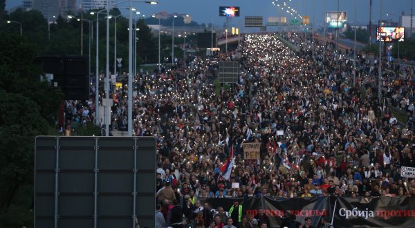 epa10639534 Protesters march on the E-75 highway during a rally against violence in Belgrade, Serbia, 19 May 2023. Opposition political parties have called on a peaceful protest against violence in Serbian society following two mass shootings.  EPA/ANDREJ CUKIC