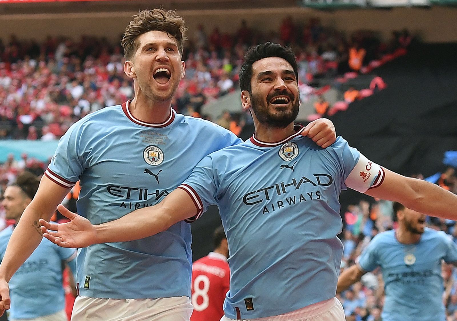 epa10670820 Ilkay Gundogan (R) of Manchester City celebrates with teammate John Stones (L) after scoring the 2-1 goal during the FA Cup final soccer match between Manchester City and Manchester United, in London, Britain, 03 June 2023.  EPA/ANDY RAIN EDITORIAL USE ONLY. No use with unauthorized audio, video, data, fixture lists, club/league logos or 'live' services. Online in-match use limited to 120 images, no video emulation. No use in betting, games or single club/league/player publications.