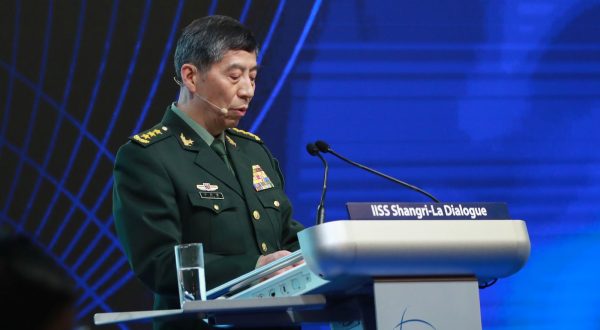 epa10671809 Chinese State Councilor and Minister of National Defence General Li Shangfu delivers his speech during a plenary session of the International Institute for Strategic Studies (IISS) Shangri-la Dialogue at the Shangri-la hotel in Singapore, 04 June 2023. Defense ministers and officials from 41 countries are gathered in the city state for the IISS Shangri-la Dialogue, an annual high level defence summit in the Asia Pacific region.  EPA/HOW HWEE YOUNG