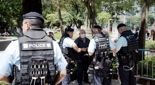 epa10671967 Police stop and search activist Bull Tsang Kin-shing (C) at Victoria Park, the traditional venue for a vigil commemorating the 1989 Beijing Tiananmen Square crackdown, in Hong Kong, China, 04 June 2023. The annual candlelight vigil in Victoria Park is cancelled for the fourth year in a row, as part of the park is being closed for renovation and pro-Beijing organisations will host a carnival on the grounds instead. Hong Kong was the only city on Chinese soil to publicly hold mass memorials in the past three decades to commemorate the 1989 Beijing Tiananmen Square crackdown but police banned the vigils in 2020 and 2021 citing COVID-19 pandemic health concerns and closed down parts of the Victoria park last year due to security concerns.  EPA/Bertha Wang