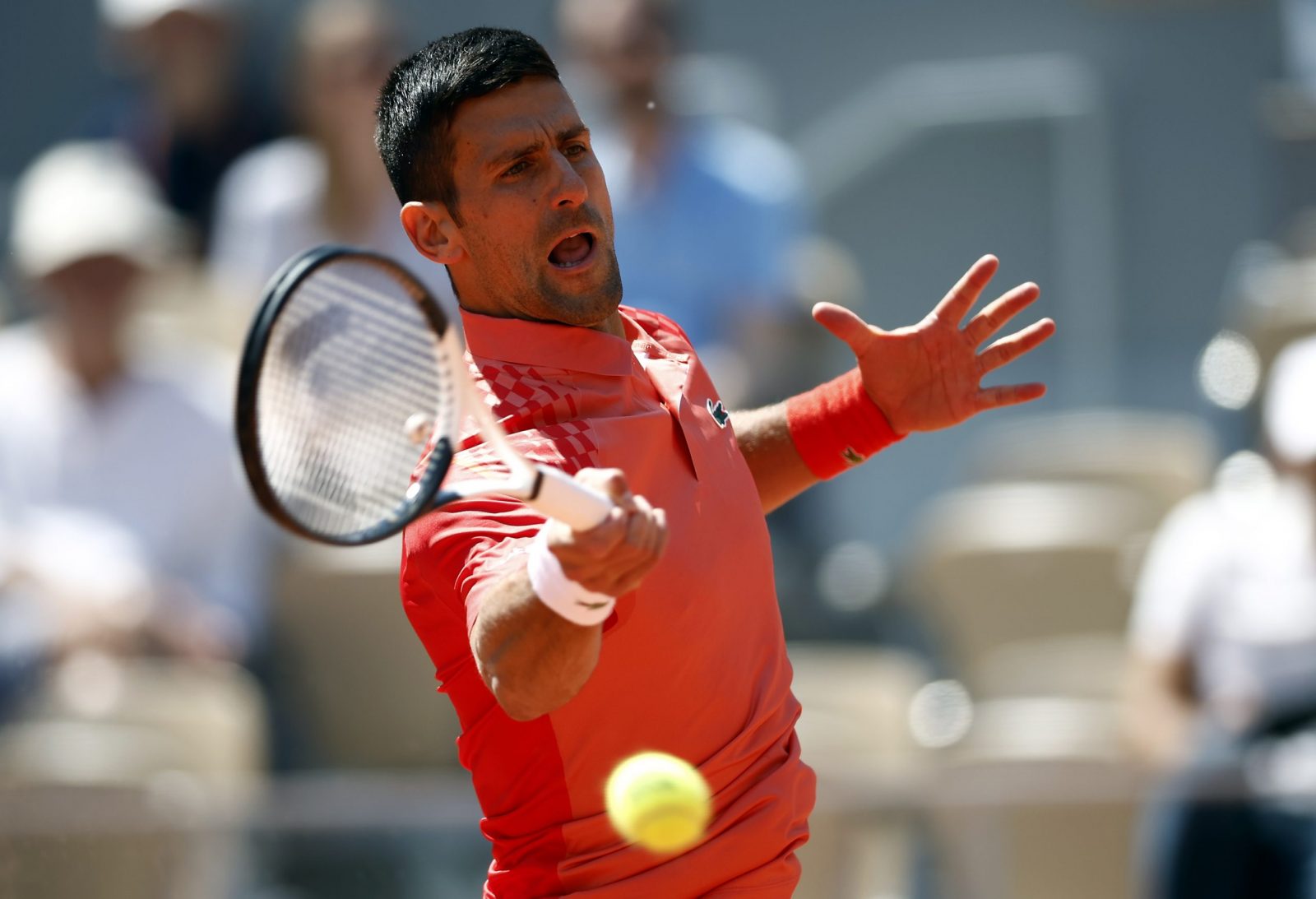 epa10672260 Novak Djokovic of Serbia plays Juan Pablo Varillas of Peru in their Men's Singles fourth round match during the French Open Grand Slam tennis tournament at Roland Garros in Paris, France, 04 June 2023.  EPA/YOAN VALAT