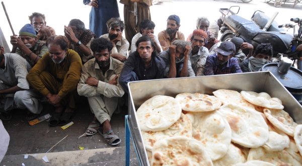 epa10676262 People wait to get free food on the eve of the World Food Safety Day in Hyderabad, Pakistan 06 June 2023. According to report 'The Hunger Hotspots' released on 29 May by the United Nations, 22 countries will experience an increase in acute food insecurity over the next six months. Afghanistan, Nigeria, Somalia, South Sudan, and Yemen are at the highest alert level, while Haiti, the Sahel, and Sudan are at the highest concern levels. Low to middle income countries will be driven further into crisis due to unusually high global food prices. Pakistan, the Central African Republic, Ethiopia, Kenya, the Democratic Republic of Congo, Syria, and Myanmar are also hotspots of very high concern. The UN has called for urgent humanitarian action to save lives and livelihoods and prevent starvation and death in hotspots where acute hunger is at a high risk of worsening from June to November 2023.  EPA/NADEEM KHAWAR