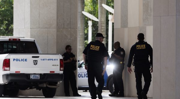 epa10688596 Police officers outside of the Wilkie D. Ferguson United States Courthouse where former President Donald Trump is scheduled to surrender today federal authorities in Miami, Florida, USA, 13 June 2023. Trump is facing multiple federal charges stemming from an US Justice Department investigation lead by Special Counsel Jack Smith related to Trumpâ€™s alleged mishandling of classified national security documents.  EPA/JUSTIN LANE
