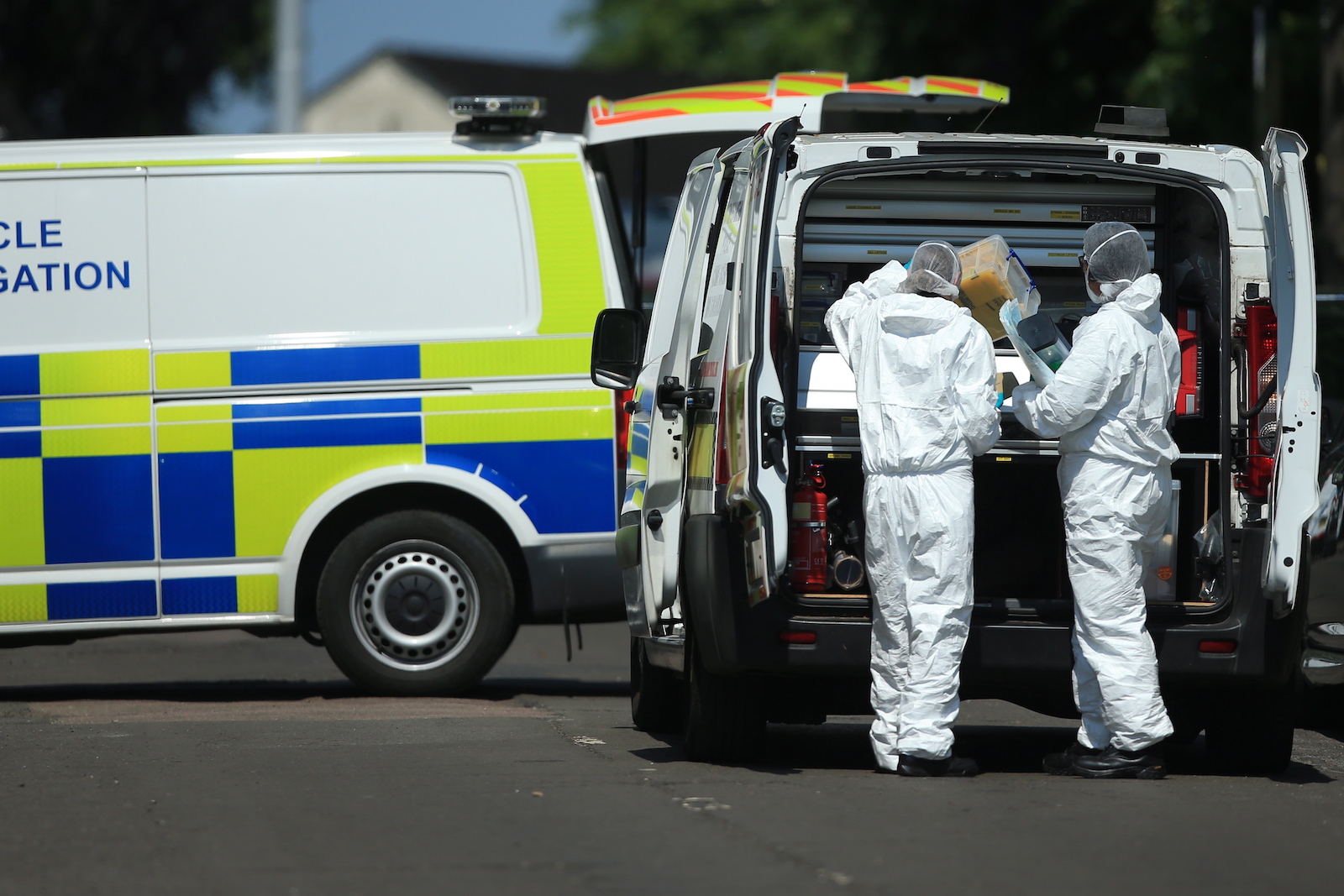 epa10688633 Police forensic officers inspect the scene where a van was found on Bentinck Road in Nottingham, Britain, 13 June 2023. Three people were found dead following what police describe as an 'horrific and tragic incident'. A 31-year-old man was arrested on suspicion of murder. Another three people are in hospital after someone tried to run them over in a van. Police believe the incidents are connected.  EPA/LINDSEY PARNABY