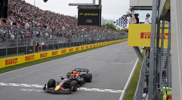 epa10698915 Dutch Formula One driver Max Verstappen of Red Bull Racing crosses the finishing line and wins the Formula 1 Grand Prix of Canada, at the Circuit Gilles-Villeneuve race track in Montreal, Canada, 18 June 2023.  EPA/TIMOTHY A. CLARY / POOL