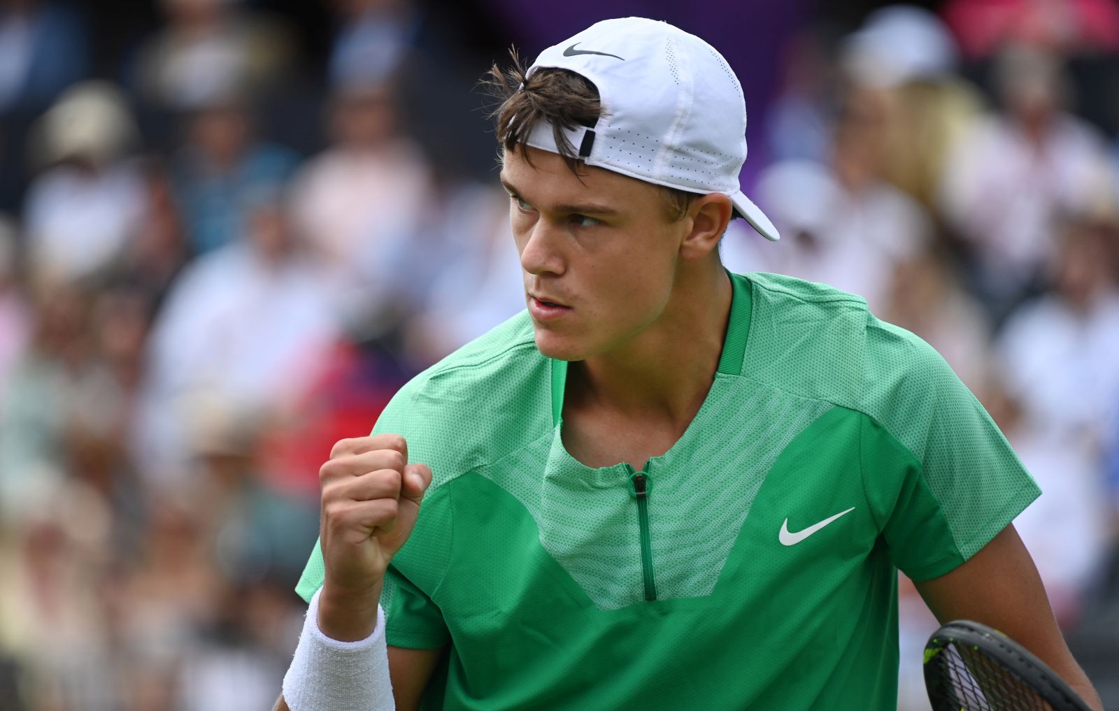 epa10701528 Denmark’s Holger Rune reacts after winning a point against Maxime Cressy of the US during their round of 32 match at the Cinch Tennis Championship in London, Britain, 20 June 2023.  EPA/ANDY RAIN