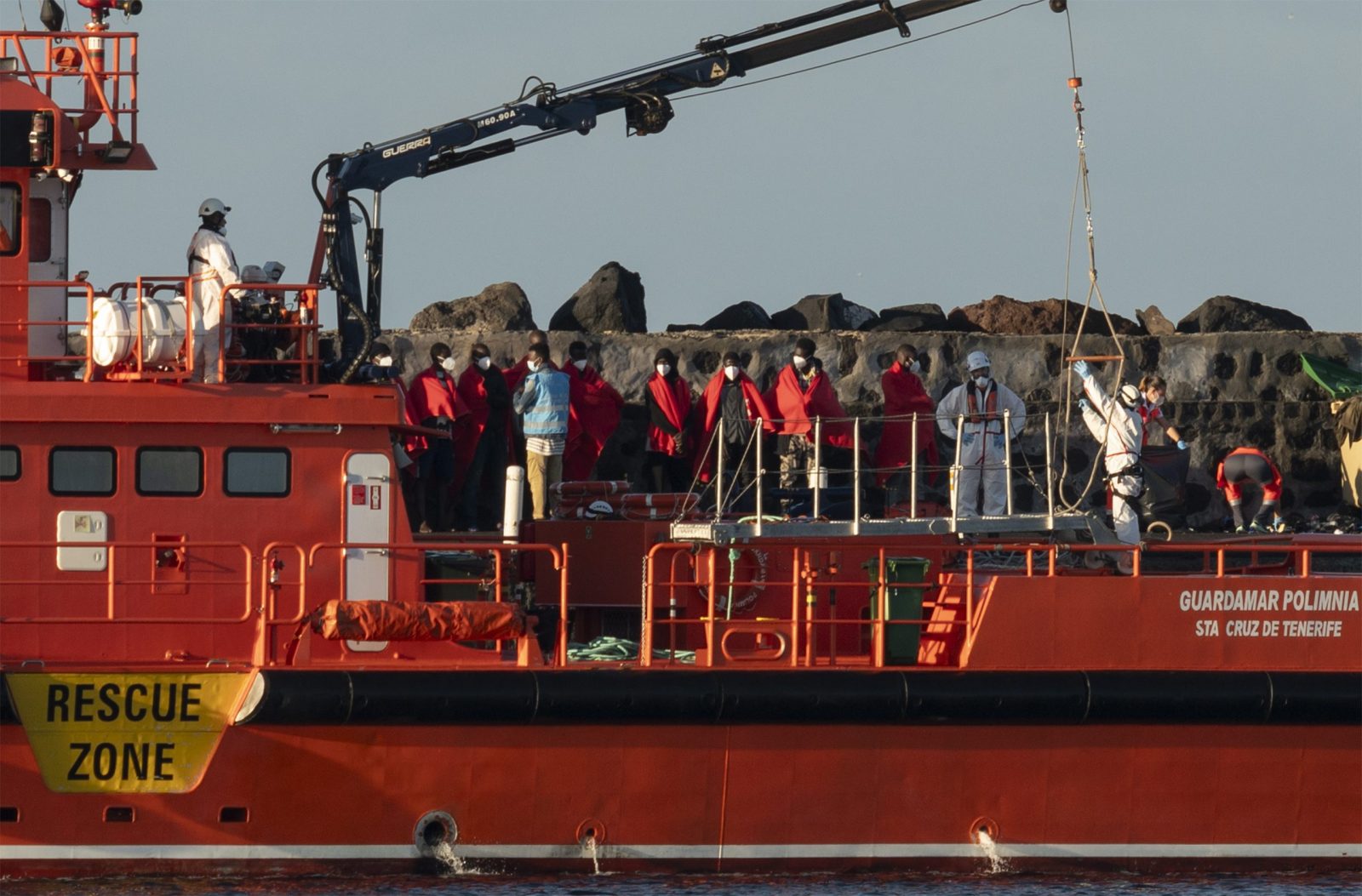 epa10705236 A group of 54 migrants arrive to Arrecife port in Lanzarote, Canary Islands, Spain, 22 June 2023, after they were rescued at sea as they were trying to reach the Spanish coast.  EPA/Adriel Perdomo