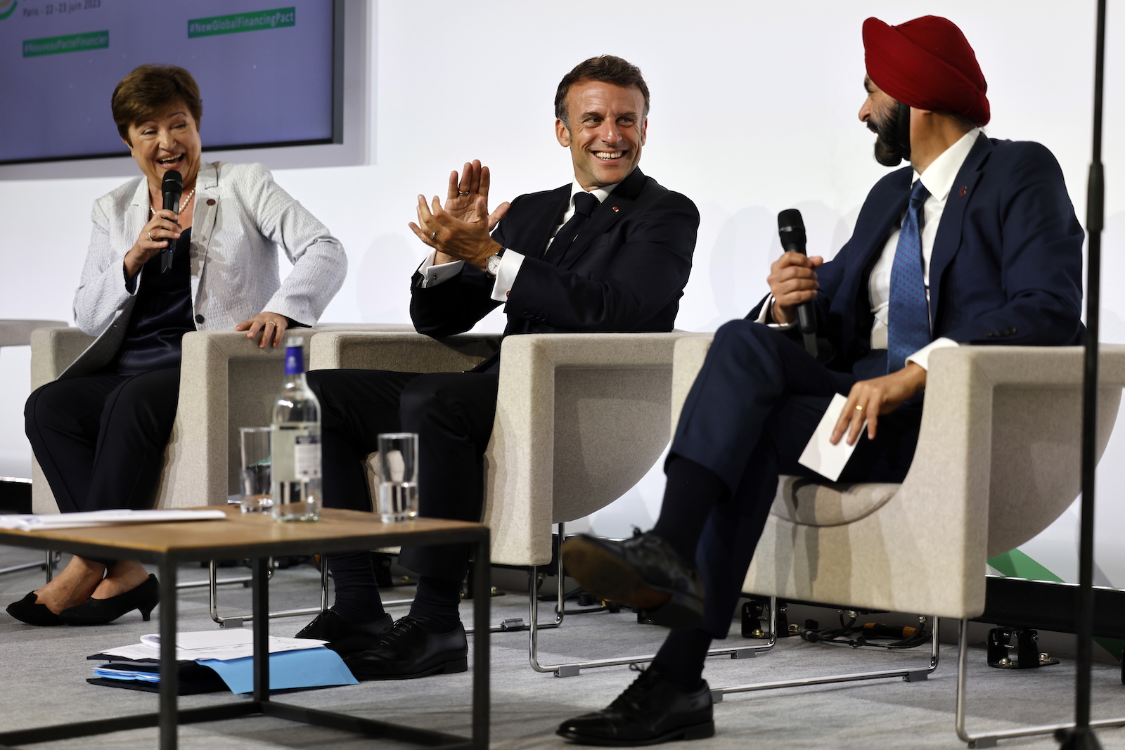 epa10705456 French President Emmanuel Macron (C) looks on as he takes part in a round table to discuss the global economy with World Bank President Ajay Banga (R) and Managing Director of the International Monetary Fund (IMF), Kristalina Georgieva during the New Global Financial Pact Summit at the Palais Brongniart in Paris, France, 22 June 2023. World leaders, heads of international organizations and activists are gathering in Paris for a two-day summit aimed at seeking better responses to tackle poverty and climate change issues by reshaping the global financial system.  EPA/LUDOVIC MARIN / POOL  MAXPPP OUT