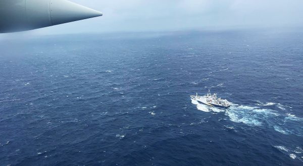epa10706581 A handout photo made available by the US Coast Guard shows a Coast Guard Air Station Elizabeth City, North Carolina HC-130 Hercules airplane flies over the French research vessel, L'Atalante approximately 900 miles East of Cape Cod during the search for the 21-foot submersible, Titan, in Boston, Massachusetts, USA, 21 June 2023 (issued 22 June 2023). The United States Coast Guard, along with Canadian authorities, is searching the ocean depths for a submersible with Ocean Gate Expeditions, carrying tourists visiting the Titanic wreckage, 900 miles (1500 km) off the coast of Cape Cod, that lost contact on 18 June 2023.  EPA/PETTY OFFICER 1ST CLASS AMBER HOWIE HANDOUT  HANDOUT EDITORIAL USE ONLY/NO SALES