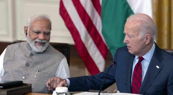 epa10708323 Indian Prime Minister Narendra Modi (L) and US President Joe Biden (R) hold hands during a meeting with senior officials and CEOs of US and Indian companies gathered to discuss innovation, investment and manufacturing in a variety of technology sectors, at the White House in Washington, DC, USA, 23 June 2023.  EPA/CHRIS KLEPONIS / POOL