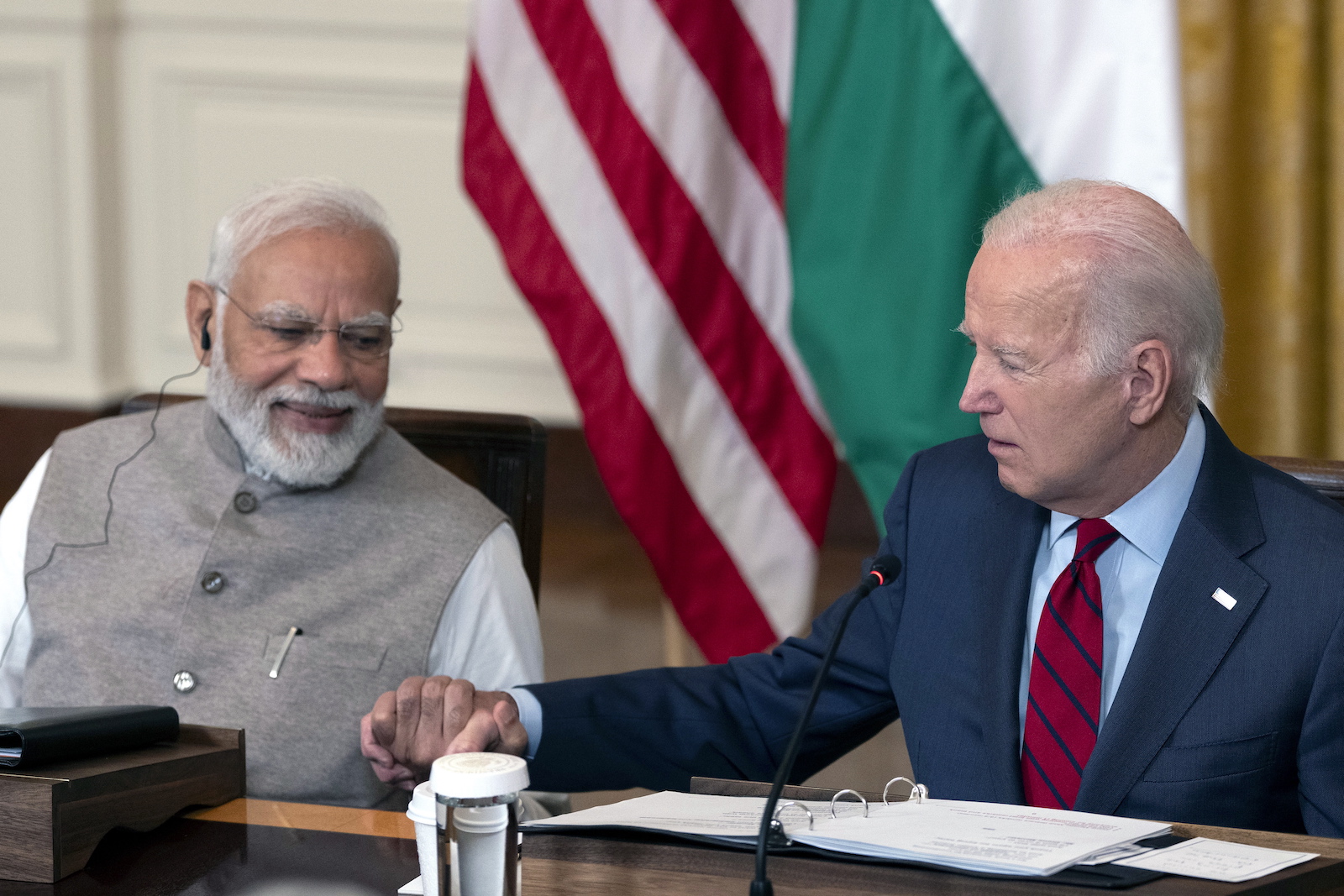 epa10708323 Indian Prime Minister Narendra Modi (L) and US President Joe Biden (R) hold hands during a meeting with senior officials and CEOs of US and Indian companies gathered to discuss innovation, investment and manufacturing in a variety of technology sectors, at the White House in Washington, DC, USA, 23 June 2023.  EPA/CHRIS KLEPONIS / POOL