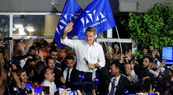 epa10711323 Leader of New Democracy political party Kyriakos Mitsotakis (C) greets supporters after the announcement of the first results in the Greek general elections, at the party's headquarters, in Athens, Greece, 25 June 2023. With nearly 90 percent of the votes counted, New Democracy will form a stand-alone government for a second term with 158 seats in a 300-seat Parliament and 40.51 percent of the votes, followed by SYRIZA with 47 (17.84 percent) and PASOK-KINAL with 32 seats (11.97 percent). Greece held its second general election in five weeks on June 25, after current Prime Minister Mitsotakis won the May 2023 elections but fell short of enough seats in parliament to form a government.  EPA/ALEXANDROS VLACHOS