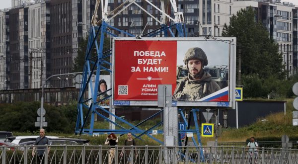 epa10712490 People walk past billboards depicting soldiers and carrying slogans reading 'The victory will be ours!' in St. Petersburg, Russia, 26 June 2023. On 24 June, counter-terrorism measures were enforced in Moscow and other Russian regions after private military company (PMC) Wagner Group chief Yevgeny Prigozhin claimed that his troops had occupied the building of the headquarters of the Southern Military District in Rostov-on-Don, demanding a meeting with Russia's defense chiefs. Belarusian President Lukashenko, a close ally of Putin, negotiated a deal with Wagner chief Prigozhin to stop the movement of the group's fighters across Russia, the press service of the President of Belarus reported. The negotiations were said to have lasted for the entire day. Prigozhin announced that Wagner fighters were turning their columns around and going back in the other direction, returning to their field camps.  EPA/ANATOLY MALTSEV
