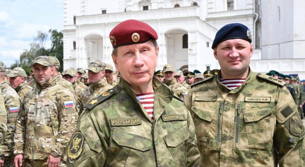 epa10713846 Commander of the National Guard (Rosgvardia) Viktor Zolotov (C) looks on before an address of the Russian President Vladimir Putin to units of the Russian Defence Ministry, the Russian National Guard Troops (Rosgvardiya), the Russian Ministry of Internal Affairs (MVD), the Russian Federal Security Service (FSB) and the Russian Federal Protective Service (FSO), who ensured order and legality during the mutiny, at the Kremlin, in Moscow, Russia, 27 June 2023. 'Units of the Ministry of Defense, the National Guard, employees of the Ministry of Internal Affairs and special services ensured the reliable operation of the most important control centers, strategic, including defense facilities, the security of border regions, the strength of the rear of our armed forces, all military formations that continued to heroically fight at the front at that time ', Putin said, referring to the units of the Ministry of Defense, the Russian Guard, the FSB, the Ministry of Internal Affairs and the FSO, which participated in the suppression of the attempted rebellion on June 24.  EPA/SERGEY GUNEEV / SPUTNIK / KREMLIN / POOL MANDATORY CREDIT