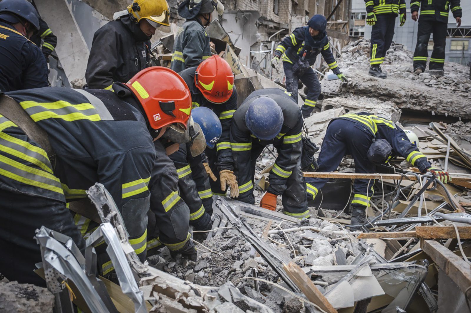 epa10715614 A handout photo made available by the State Emergency Service of Ukraine shows rescuers at work at the site of a rocket strike in downtown Kramatorsk, Donetsk area, Ukraine, 28 June 2023, amid the Russian invasion. According to the National Police, two short-range ballistic Iskander rockets hit Kramatorsk in the evening of 27 June. At least 11 people, including the three children, were killed and 56 others were injured, the State Emergency Service confirmed on 28 June.  EPA/STATE EMERGENCY SERVICE HANDOUT  HANDOUT EDITORIAL USE ONLY/NO SALES