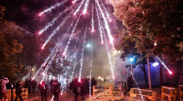 epa10716123 Protesters throw fireworks at riot police during clashes in Nanterre, near Paris, France, 29 June 2023. Violence broke out after police fatally shot a 17-year-old during a traffic stop in Nanterre on 27 June 2023. According to the French interior minister, 31 people were arrested with 2,000 officers being deployed to prevent further violence.  EPA/YOAN VALAT