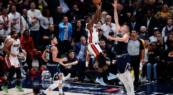 Jun 4, 2023; Denver, CO, USA; Miami Heat forward Jimmy Butler (22) takes a shot against Denver Nuggets center Nikola Jokic (15) in the second quarter in game two of the 2023 NBA Finals at Ball Arena. Mandatory Credit: Isaiah J. Downing-USA TODAY Sports Photo: Isaiah J. Downing/REUTERS