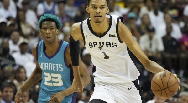 San Antonio Spurs' Victor Wembanyama drives against the Charlotte Hornets during the first half of an NBA summer league basketball game Friday, July 7, 2023, in Las Vegas. (AP Photo/John Locher)