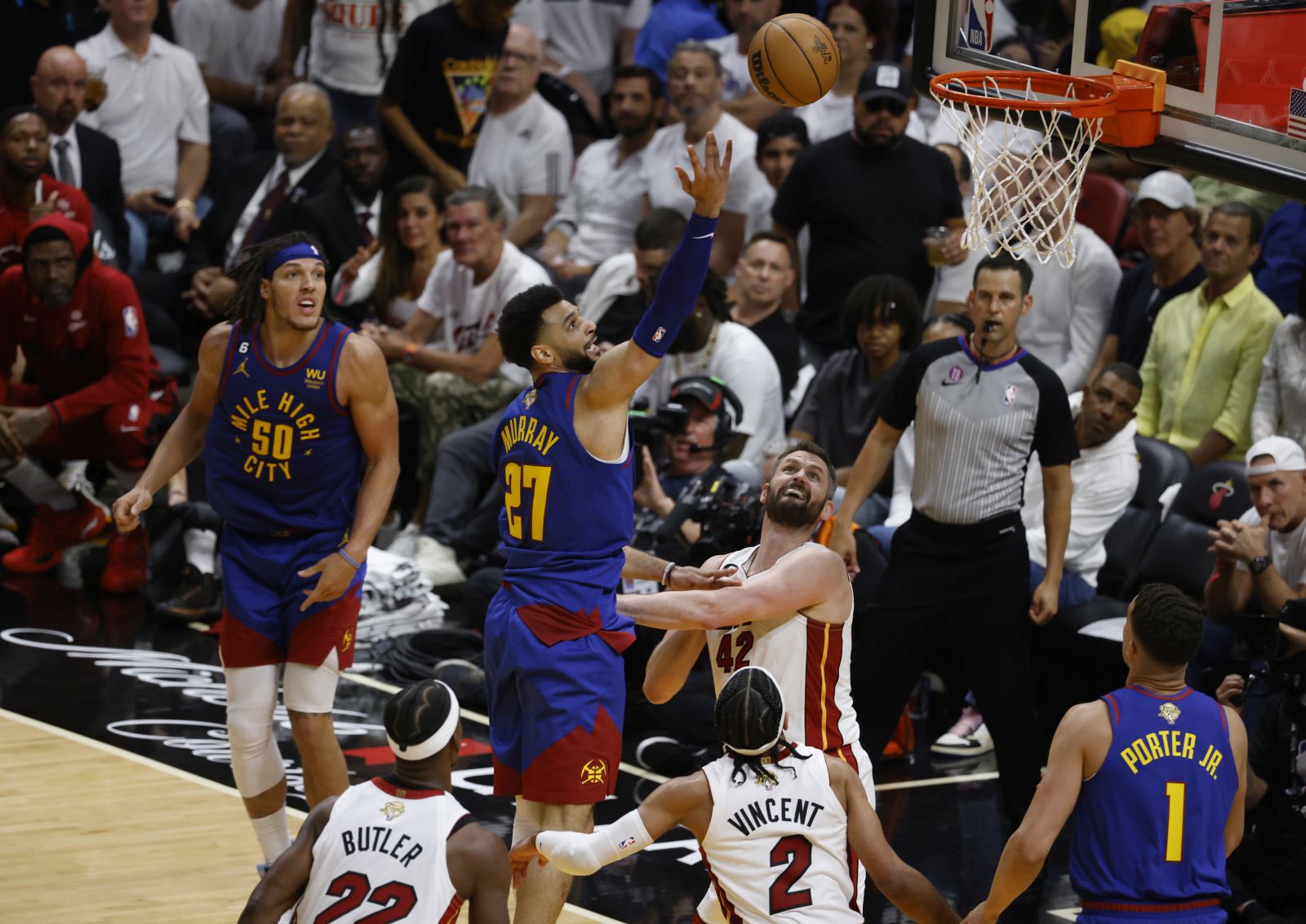 epa10678801 Denver Nuggets guard Jamal Murray (3-L) goes to the basket for two points over Miami Heat forward Kevin Love (3-R) during the second half of game three of the NBA Finals between the Denver Nuggets and Miami Heat at Kaseya Center in Miami, Florida, USA, 07 June 2023.  EPA/RHONA WISE SHUTTERSTOCK OUT