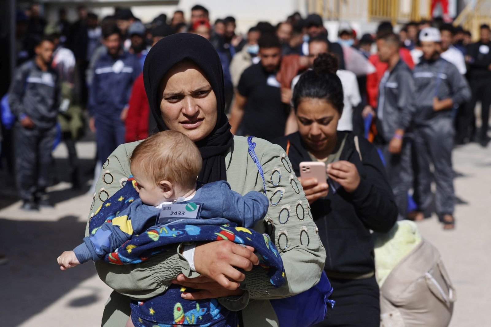 epa10692598 Migrants inside the immigrant reception facility, or 'hotspot' on the Sicilian island of Lampedusa (Agrigento), southern Italy, 14 June 2023 (issued 15 June 2023). The Lampedusa hotspot, with a capacity to host about 650 people, is managed by the Italian Red Cross (CRI). The center is intended to provide preliminary reception, identification and triage for migrants and refugees arriving on the tiny southern Italian island. Located in the Mediterranean between Malta and Tunisia, Lampedusa is a transit point for migrants from Africa, the Middle East and Asia seeking a better life in Europe. Upcoming 20 June 2023 marks World Refugee Day under the theme 'hope away from home'. The annual international day celebrates the people around the glove who have been forced to flee their home country to escape conflict or persecution.  EPA/VINCENZO LIVIERI  ATTENTION: This Image is part of a PHOTO SET
