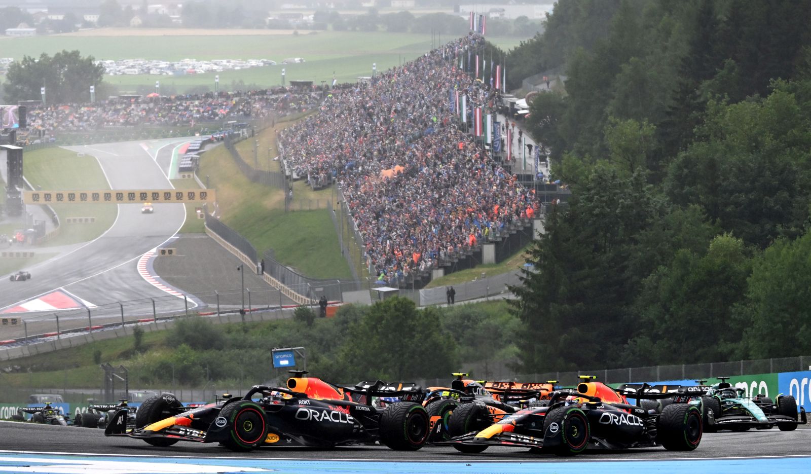 epa10720877 Dutch Formula One driver Max Verstappen (L) of Red Bull Racing during the Sprint at the Red Bull Ring race track in Spielberg, Austria, 01 July 2023. The Formula 1 Grand Prix of Austria is held on 02 July 2023.  EPA/CHRISTIAN BRUNA