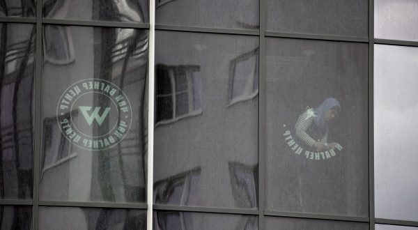 epa10722704 A worker removes the logo of the private military company (PMC) Wagner Group from the windows of the Sea Capital (Morskaya Stolitsa) business center, where Yevgeny Prigozhin's company rented several floors in St. Petersburg, Russia, 02 July 2023. On 23 June 2023, Wagner Group forces led by Prigozhin left the frontline in Ukraine and staged an 'armed mutiny' against Russia's military leadership. Prigozhin claimed on 24 June 2023 that his troops had occupied the headquarters of the Southern Military District in Rostov-on-Don, Russia, a key city near the Ukrainian border. A deal negotiated by the Belarusian president with Prigozhin stopped the Wagner forces' movement toward Moscow and ended the standoff, with Prigozhin and his fighters leaving the country.  EPA/ANATOLY MALTSEV