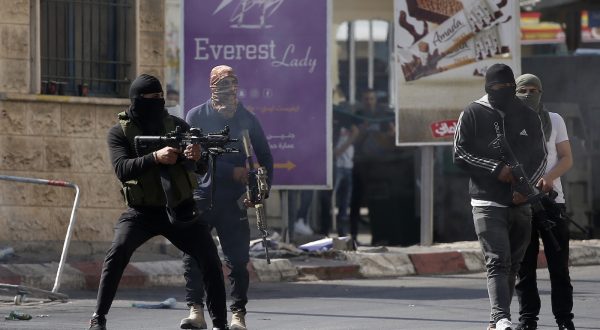 epa10723271 Palestinian militants engage in a firefight with the Israeli military in Jenin, the West Bank, 03 July 2023. The Israel Defense Forces announced on 03 July that they launched a large-scale operation in Jenin. According to the Palestinian Health Ministry, at least four people were killed and 27 were wounded in Israeli military air attacks in Jenin.  EPA/ALAA BADARNEH