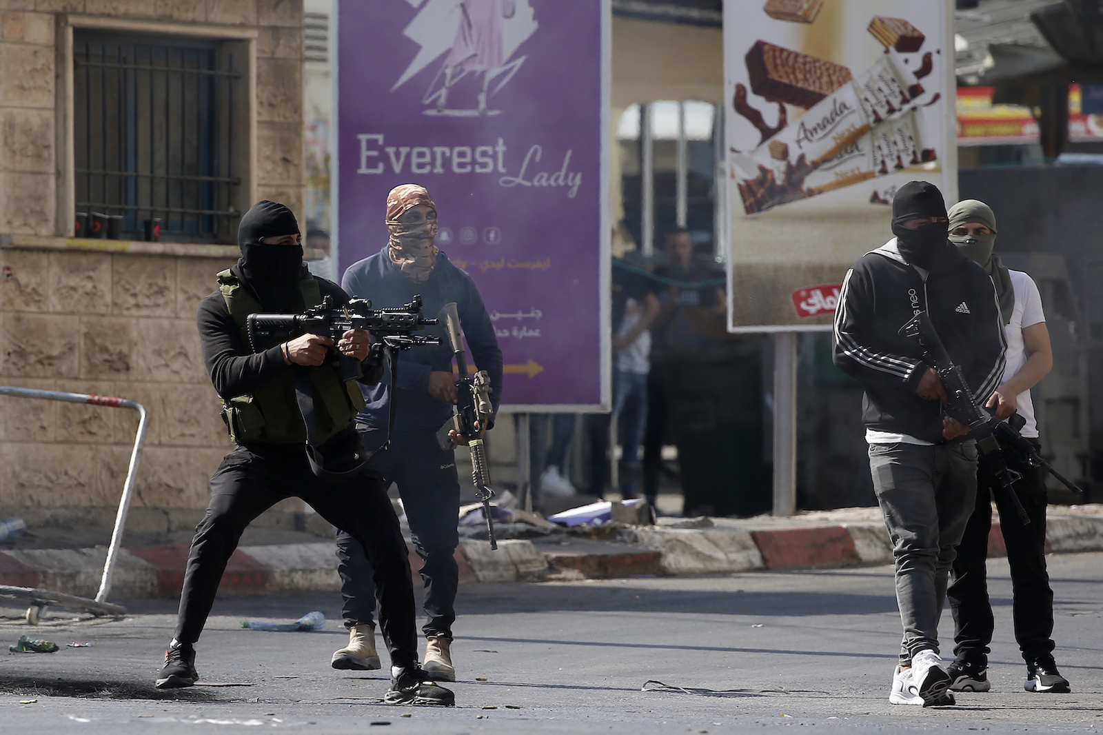 epa10723271 Palestinian militants engage in a firefight with the Israeli military in Jenin, the West Bank, 03 July 2023. The Israel Defense Forces announced on 03 July that they launched a large-scale operation in Jenin. According to the Palestinian Health Ministry, at least four people were killed and 27 were wounded in Israeli military air attacks in Jenin.  EPA/ALAA BADARNEH