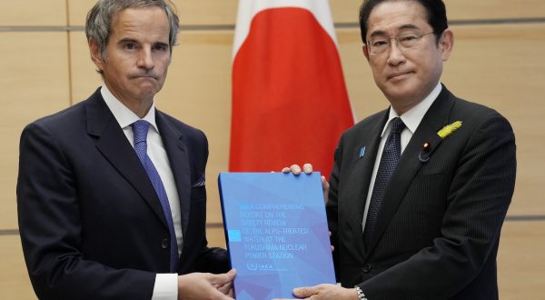 epa10725225 Rafael Mariano Grossi (L), Director General of the International Atomic Energy Agency, presents IAEA's comprehensive report on Fukushima Treated Water Release, to  Japanese Prime Minister Fumio Kishida (R), at the prime minister's in Tokyo, Japan, 04 July 2023.  EPA/Eugene Hoshiko / POOL