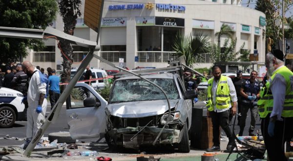 epa10725869 Israeli security forces and emergency workers operate at the site of a car ramming attack in Tel Aviv, Israel, 04 July 2023. According to the Israeli Police on 04 July, about 7 people were injured after a "suspect that was driving a vehicle on Pinchas Rosen street, rammed into pedestrians standing in the shopping center and proceeded to get out of the vehicle to stab civilians with a sharp object". The man involved in the reported event was "neutralized".  EPA/ABIR SULTAN