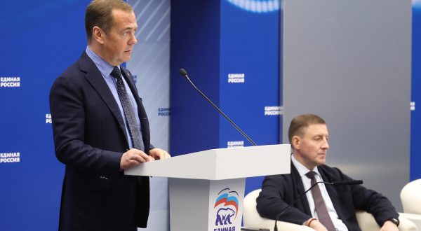 epa10726680 Deputy head of Russia's Security Council and chairman of the United Russia party, Dmitry Medvedev (L) delivers a speech as United Russia Party's General Council Secretary, Russian Federation Council Deputy Chairperson Andrei Turchak seats near during a meeting of the United Russia Party's General Council in Moscow, Russia, 04 July 2023.  EPA/EKATERINA SHTUKINA/ SPUTNIK / GOVERNMENT PRESS SERVICE POOL MANDATORY CREDIT