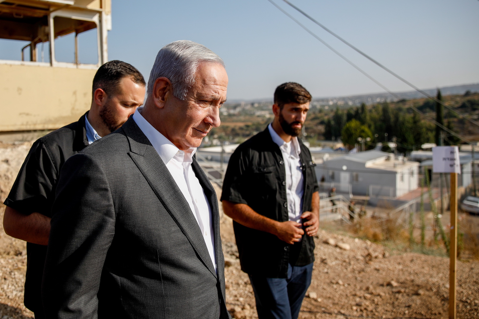 epa10726582 Israeli Prime Minister Benjamin Netanyahu arrives for a briefing near the Salem military post between Israel and the West Bank, 04 July 2023. Netanyahu indicated a military operation in the nearby Jenin refugee camp, one of the most intense in the territory in nearly two decades, was winding down, without gaving further details on when it would end and vowed to carry out similar operations in the future.  EPA/SHIR TOREM / POOL